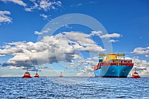 Tugboats and container ship