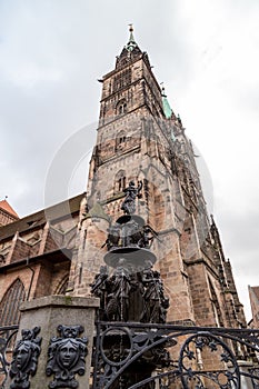 Tugendbrunnen in front of St. Lorenz church in the city Nuremberg, Bavaria, Germany