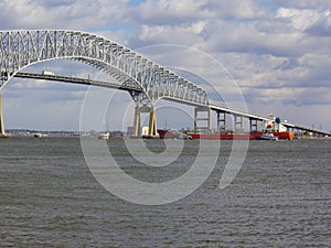Tugs assisting tanker near Baltimore`s Key Bridge photo