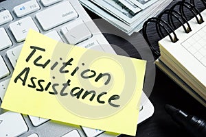 Tuition assistance handwritten on a piece of paper