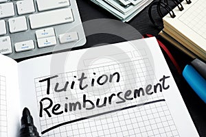 Tuition reimbursement written on a page