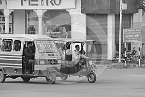 Tuk tuk car in busy traffic street in India