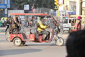 Tuk tuk car in busy traffic street in India