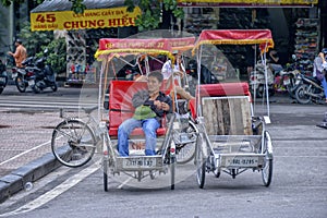 Tuktuk cyclo driver in Hanoi, Vietnam