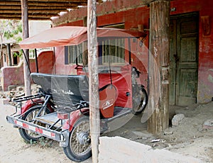 Tuk tuk parked in village house