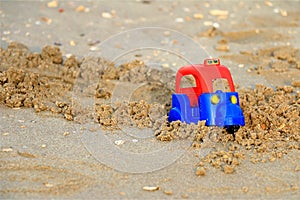 Tuk tuk, Plastic toy on the beach.