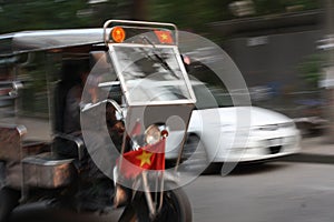 A Tuk Tuk Rickshaw at Speed in Vietnam