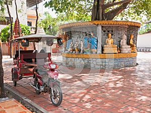 Tuk-tuk taxi at temple in Phnom Penh