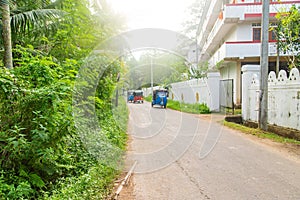 Tuk tuks ride along the road. Sri Lanka. Selective focus