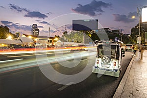 Tuk tuks wait outside Phnom Penh Night Market,at dusk,Cambodia,South east Asia