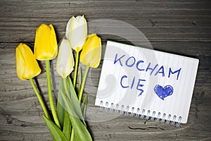 Tulip bouquet and notepad with Polish words I love you