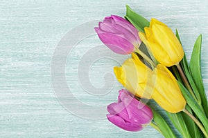 Tulip flowers on rustic table for March 8, International Womens day, Birthday or Mothers day, beautiful spring card