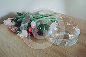 Tulip flowers on table