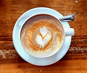 Tulip latte art on antique hot latte photo
