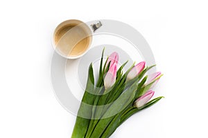 Fresh bouquet of five tulips isolated on white background with a cup of coffee. Spring flowers.