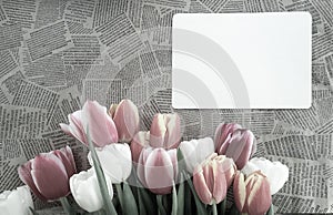 Tulips flowers bunch on Vintage newspaper background