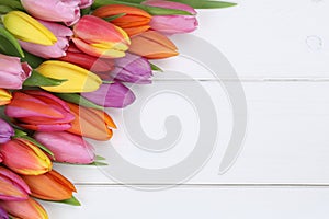 Tulips flowers in spring or mother's day on wooden board photo