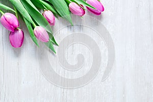 Tulips Flowers on wooden table for March 8, International Women