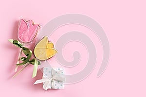 Tulips gingerbread package, spring and easter concept on pink background