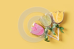 Tulips gingerbread package, spring and easter concept on yellow background