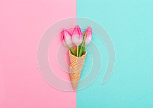 Tulips ice cream waffle cone Pink flowers flat lay Minimal