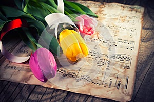 Tulips on a music notes paper