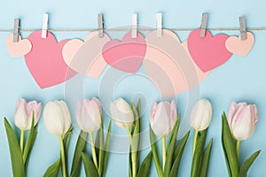 Tulips and pink paper hearts as Mother`s Day decoration