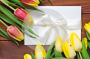 Tulips and white paper card