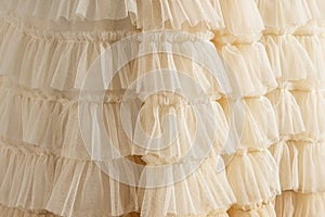 Tulle beige luxury dress with ruffles.