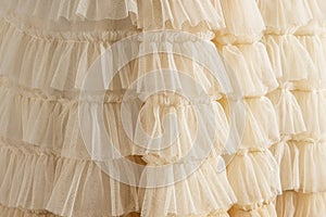 Tulle beige luxury dress with ruffles. photo
