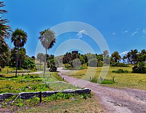 Tulum ancient Mayan port city on the Caribbean coast in Mexico YucatÃ¡n Peninsula. Views by El Castillo ruins. Central America. photo