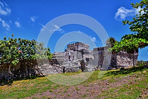 Tulum ancient Mayan port city on the Caribbean coast in Mexico YucatÃ¡n Peninsula. Views by El Castillo ruins. Central America. photo