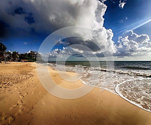 Tulum Beach with Sun Surf and Clouds