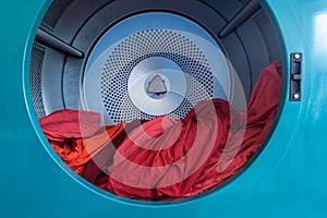 Tumble dryer. Centrifuge for drying linen and clothes. Laundry. Washer. Washing linen. The centrifuge spins and washes laundry and