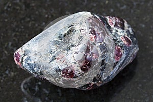 Tumbled Almandine garnet crystals on dark