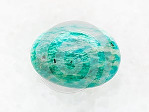 tumbled amazonite gemstone (amazon stone) on white