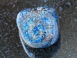 tumbled Azurite gemstone on dark background