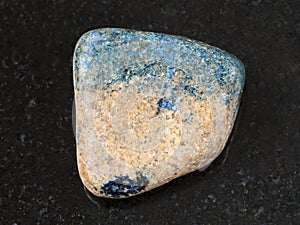 tumbled azurite stone on dark background