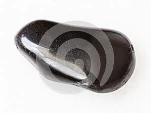 tumbled black obsidian gemstone on white