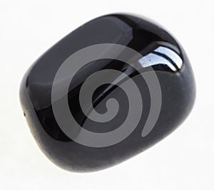 tumbled black Onyx gem stone on white