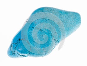tumbled blue howlite (turquenite) gem on white photo