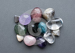 Tumbled gems of various colors. Amethyst, rose quartz, agate, apatite, aventurine, olivine, turquoise,  rock crystal