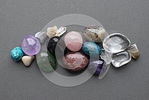 Tumbled gems of various colors. Amethyst, rose quartz, agate, apatite, aventurine, rock crystal, turquoise