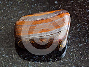 Tumbled Jaspillite stone on black