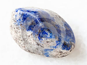 tumbled lazurite stone on white