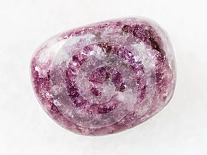 tumbled Lepidolite gemstone on white