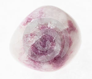 tumbled pink Sodalite gem stone on white