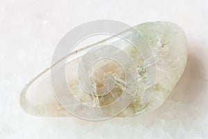 tumbled Prasiolite gemstone on white photo