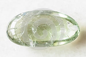 Tumbled Prasiolite green quartz rock on white