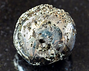 tumbled Pyrite ( fool\'s gold) rock on black
